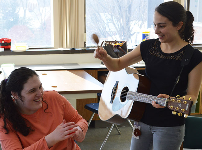 Music teacher entertains student