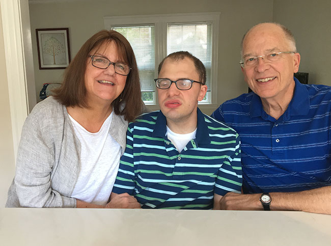 Man sitting with parents