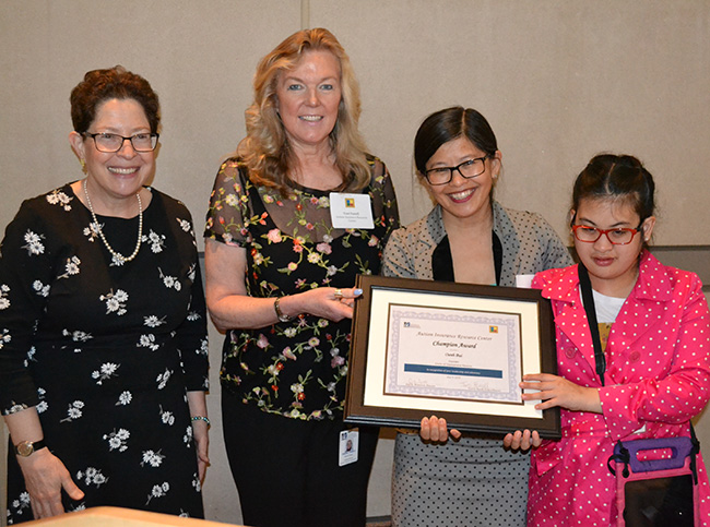 Group photo of three women and honoree's daughter