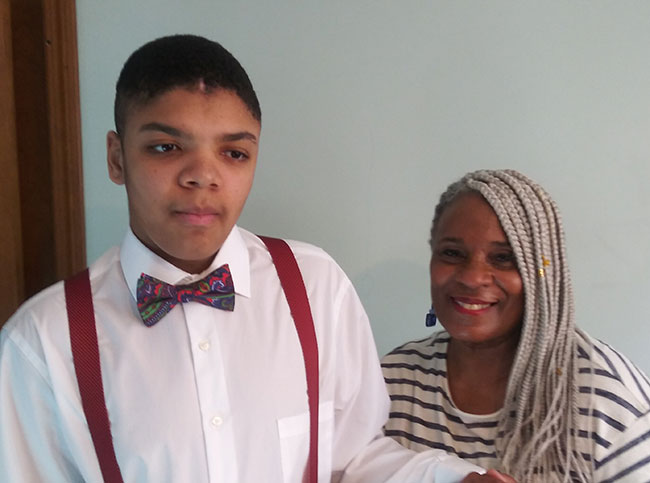 Student and grandmother standing together