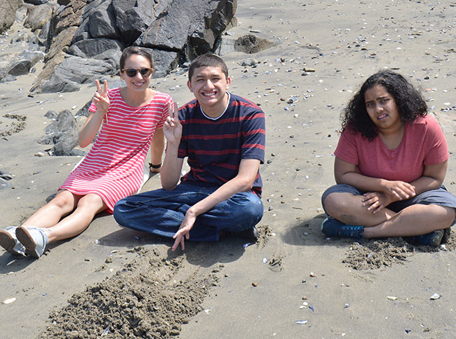 Teacher with two students at the beach