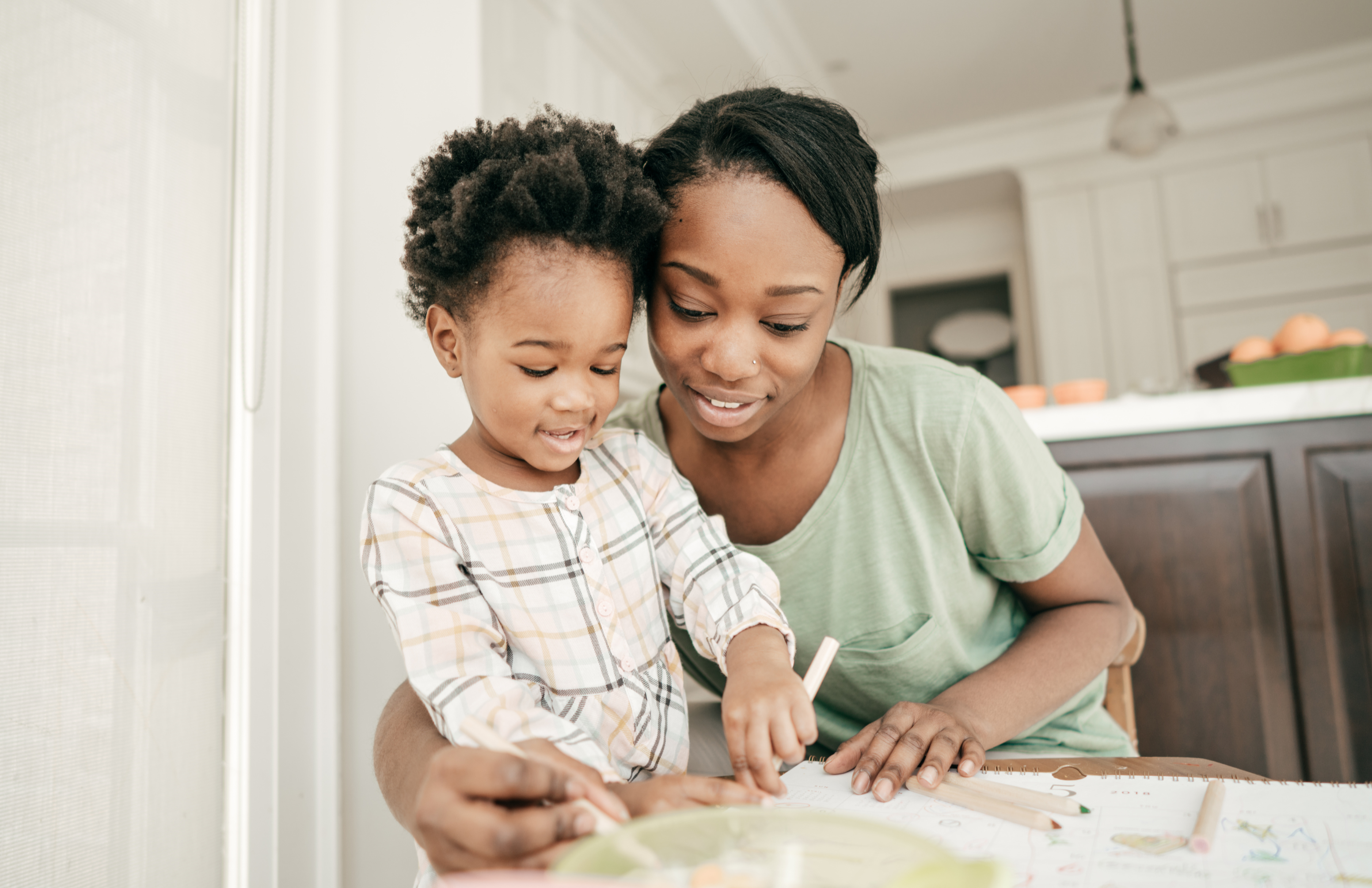 Parent and child at kitchen table