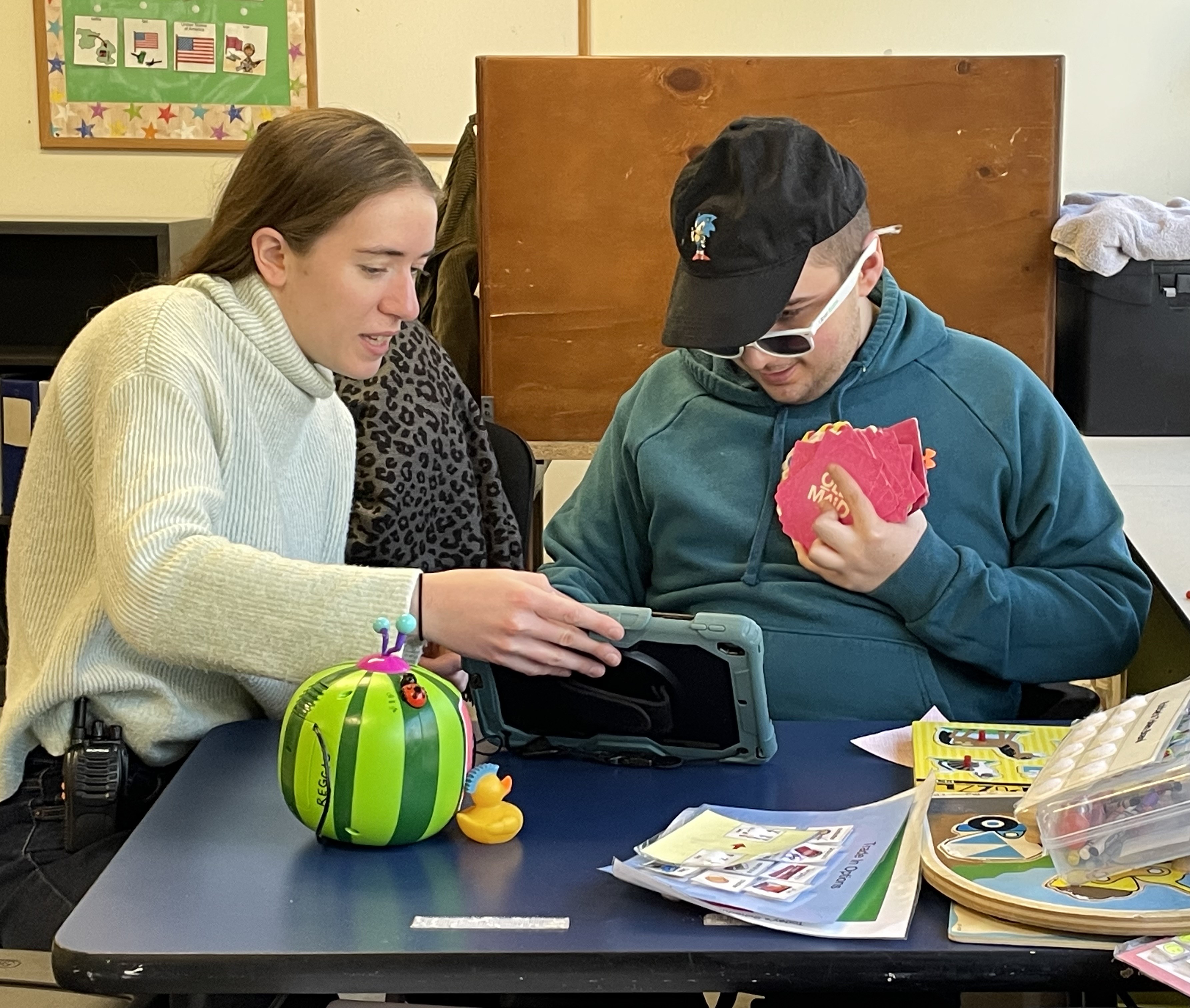 Guild staff member works with student