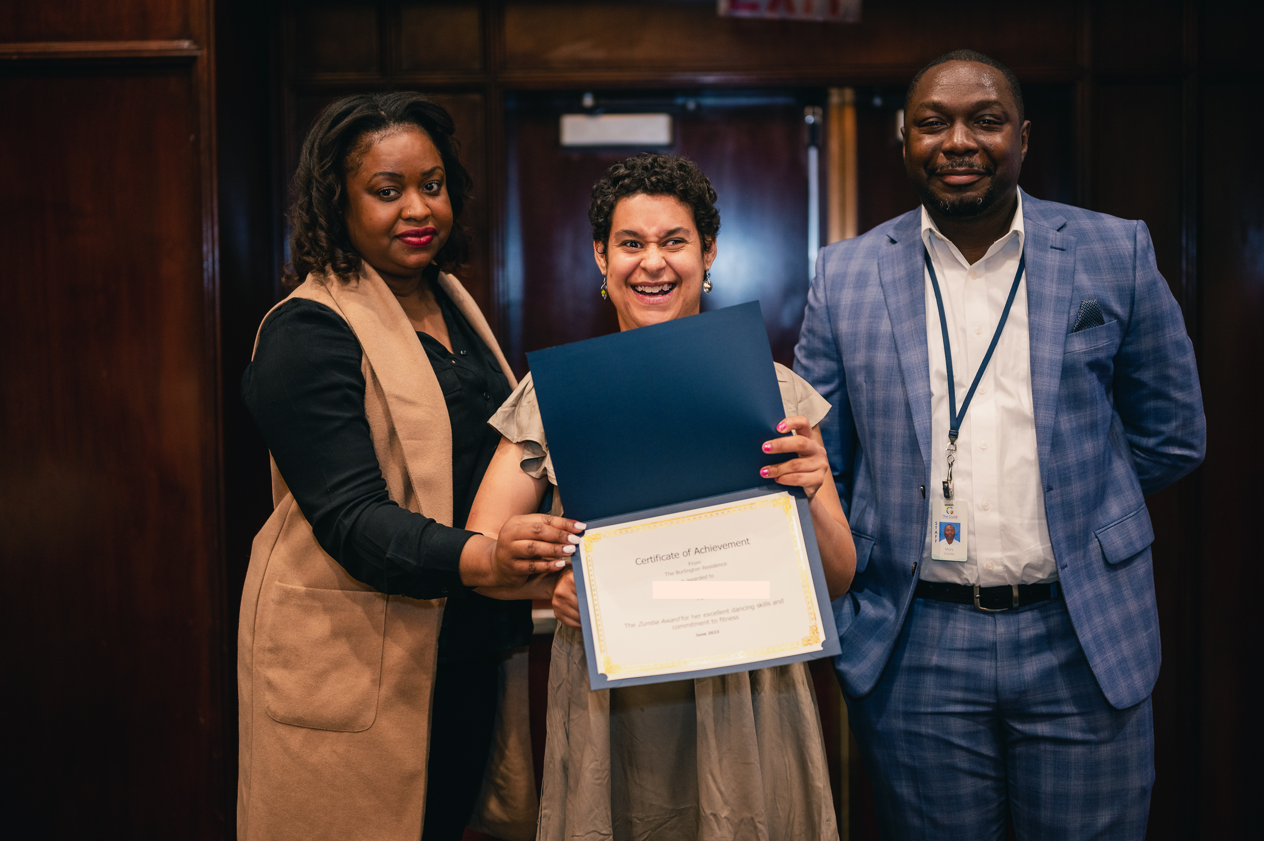 An adult with The Guild's programs receives an award 