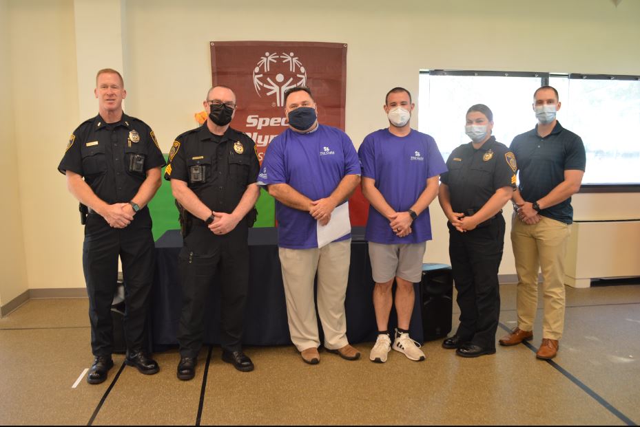 Lieutenant Kevin Monahan, Sergeant Tim Landers, Geoff Garfinkle and Lucas Bolduc of The Guild for Human Services, Sergeant Tia Manchuso, Officer John O’Connor