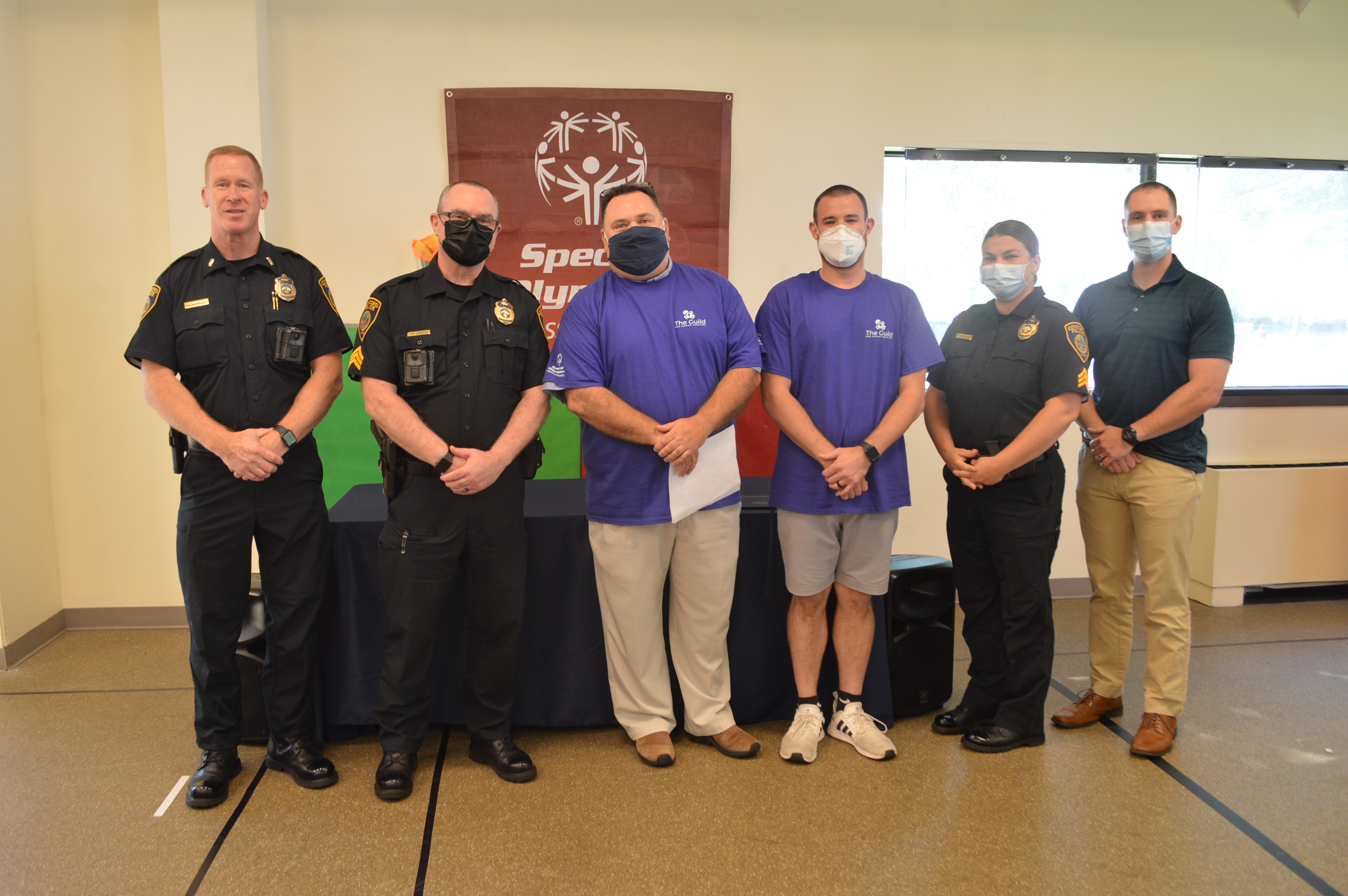 Lieutenant Kevin Monahan, Sergeant Tim Landers, Geoff Garfinkle and Lucas Bolduc of The Guild for Human Services, Sergeant Tia Manchuso, Officer John O’Connor