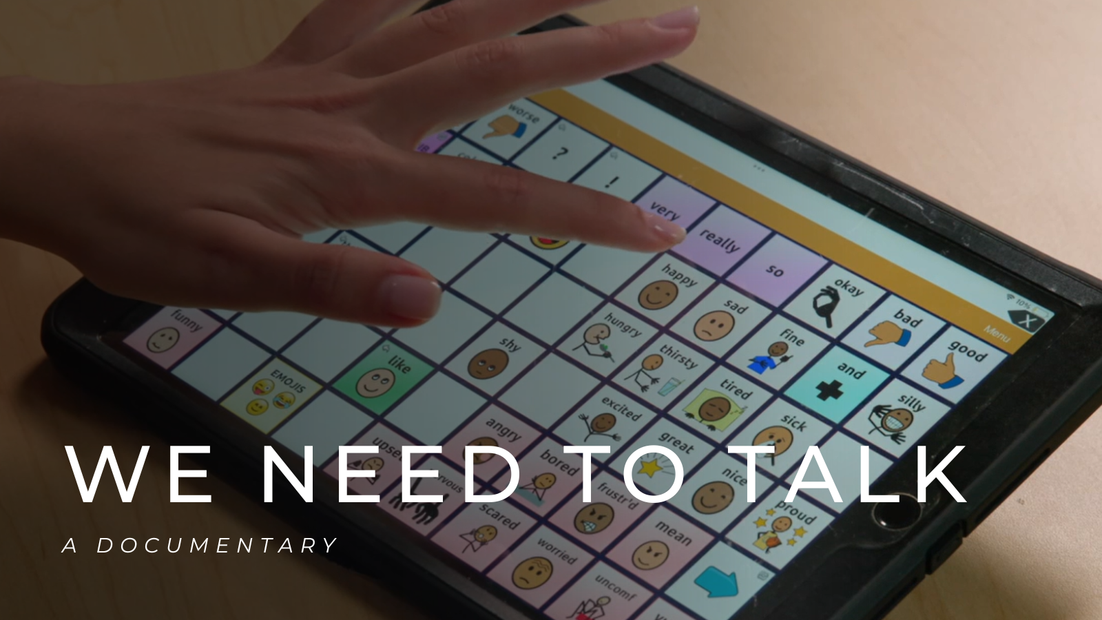 A thumbnail graphic shows an AAC device with an icon board in a speech generating app and a hand hovering over the icon for "happy". Large white letters read "We Need to Talk: a documentary"