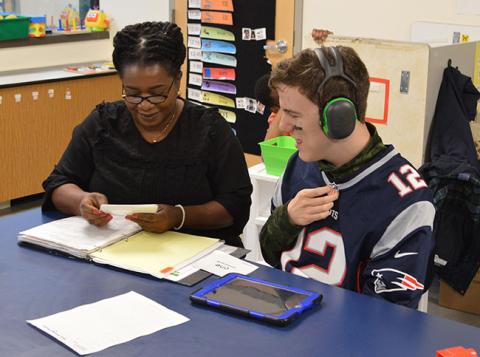 Student learning from staff