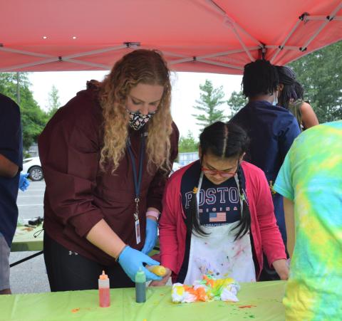 Student and teacher creating tie-dye