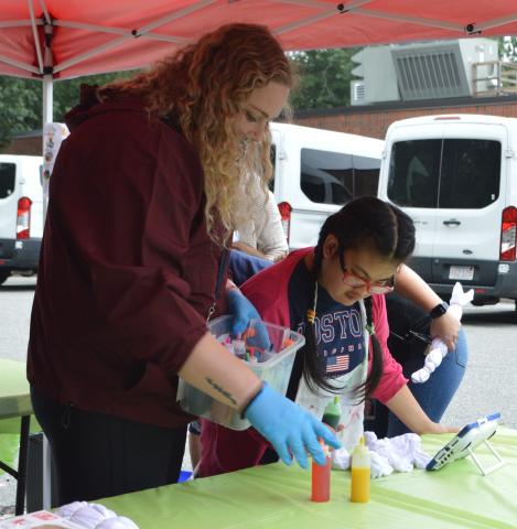 Guild staff and student creating tie-dye