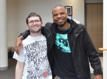 Student and man standing together