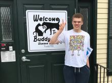 Student standing outside of building.