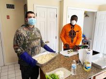 House manager Mory and resident cooking