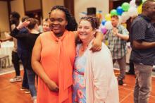 Nikki Bryant, BCBA, with an adult at The Guild's annual dance 